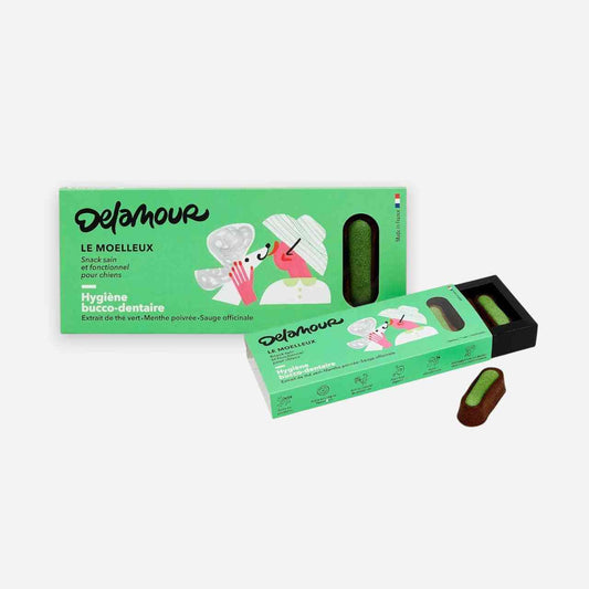 Moelleux Hygiène Dentaire Chien Delamour à la menthe poivrée et sauge, présenté dans une boîte verte avec stick semi-fondant visible. Idéal pour la santé bucco-dentaire des chiens.